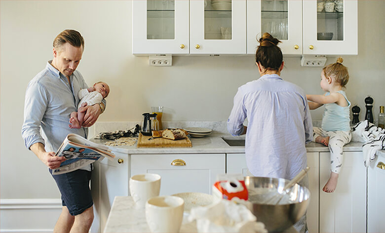 Family in a white kitchen.